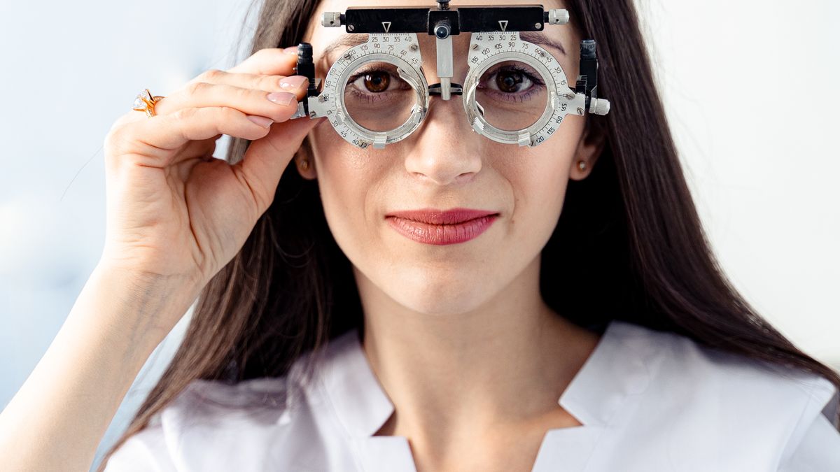 Woman wearing an optometry trial frame during an eye exam