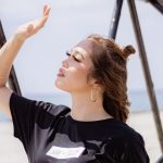 Person shading eyes from bright sunlight