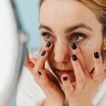 Person applying eye drops