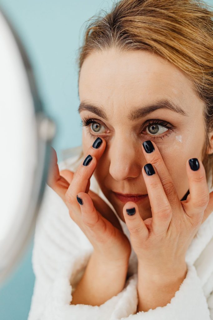 Person applying eye drops